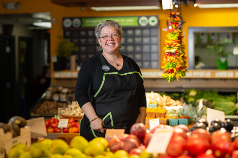 Person standing in produce section